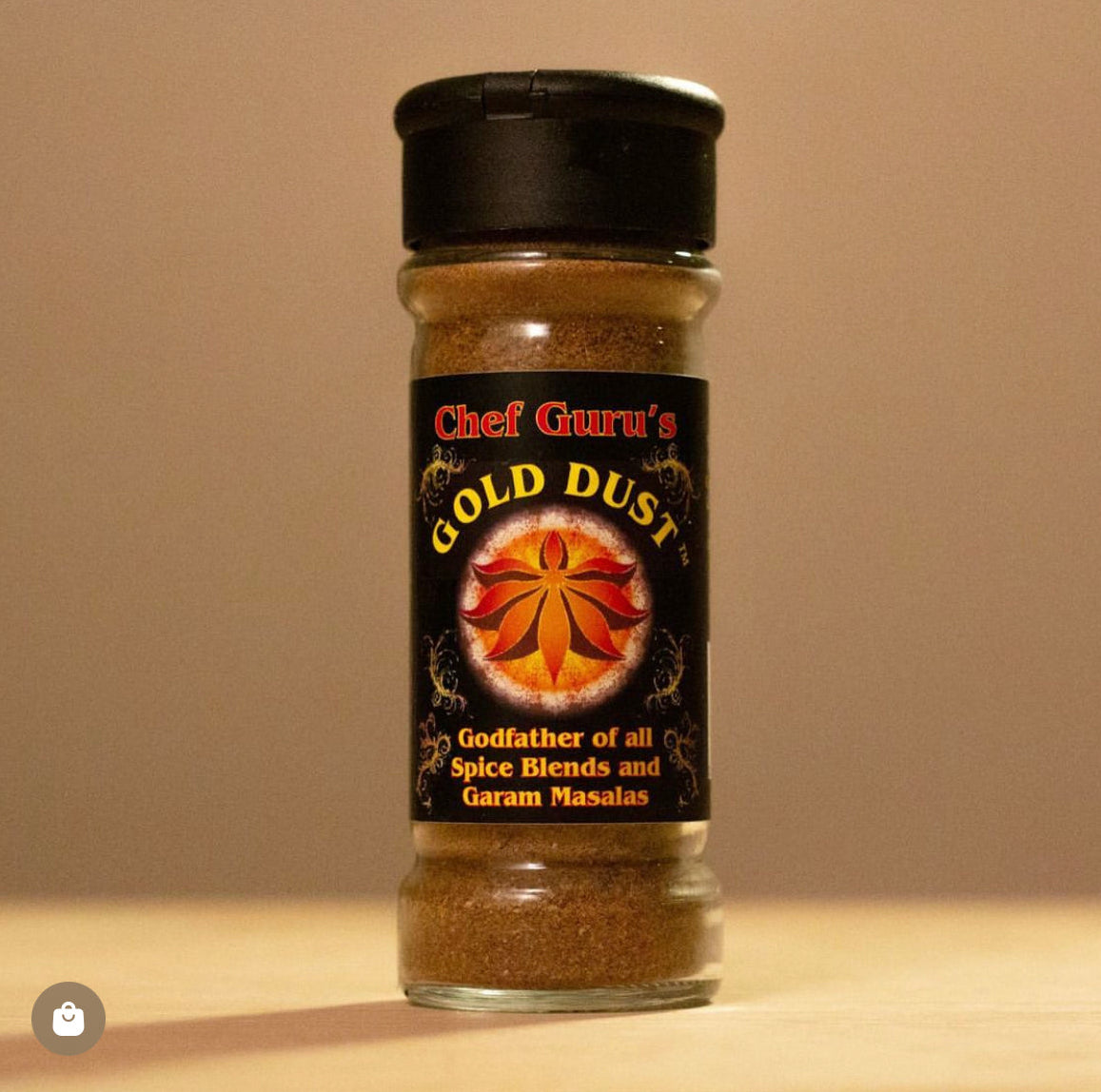 Spice jar labeled 'Chef Guru's Gold Dust' on a beige background